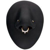 Kultainen Marquise-septumklikkeri kimaltelevilla kristalleilla mustalla mallilla