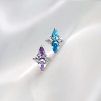 Push Fit Crystal Harmony -laventeli & turkoosi Kaksi Push Fit -päätä titaanista laventelin ja turkoosin väreissä valkoisella taustalla
