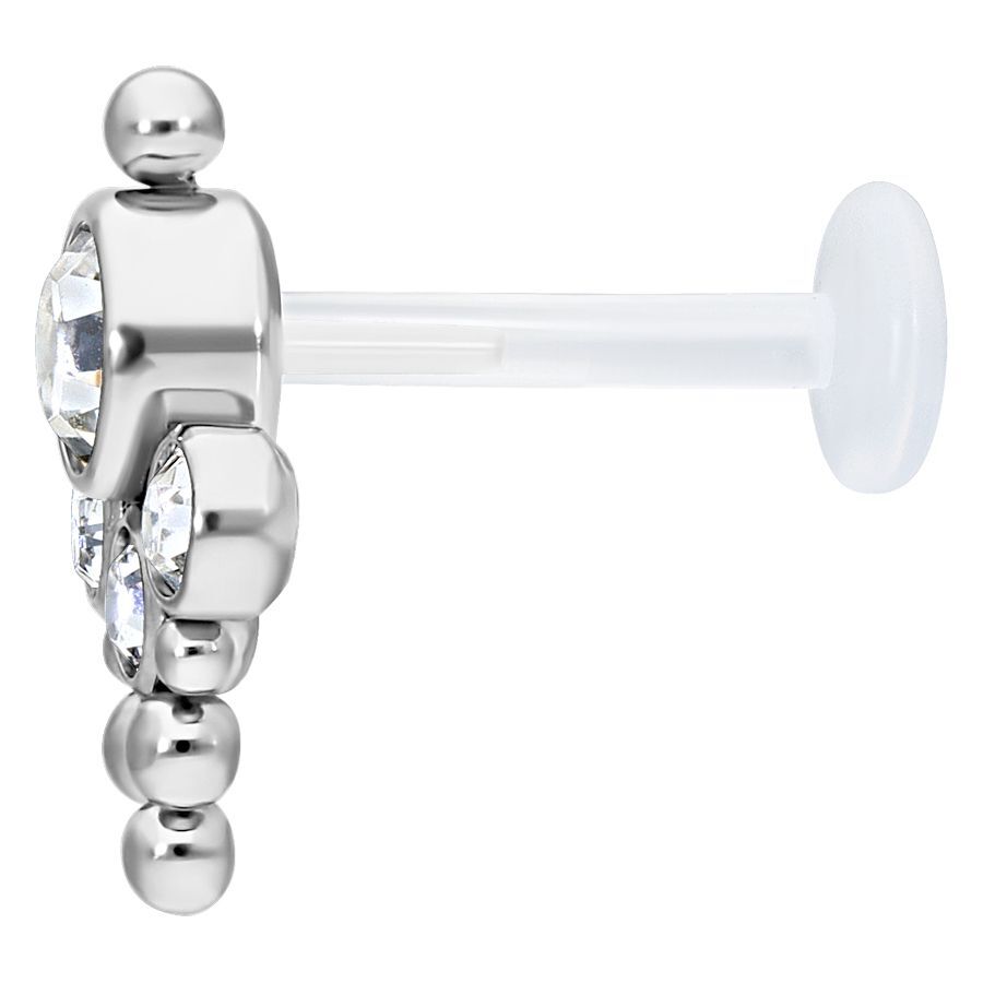 Bindi Push-fit Labret kirkkaalla kristallilla Bindi Push-fit Labret titaanista ja bioplastista kirkkaalla kristallilla valkoisella taustalla