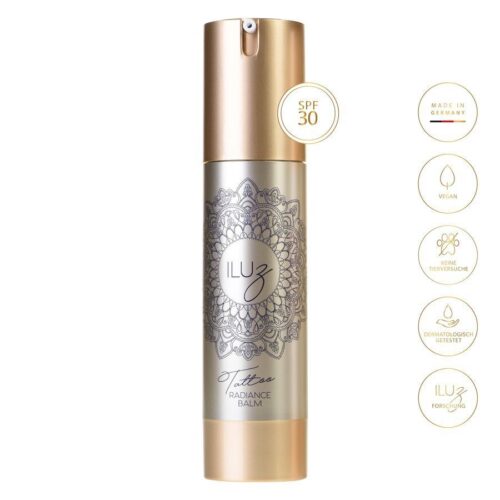 Hopeinen Radiance Balm -pullo kultaisella korkilla ja mandala-kuviolla