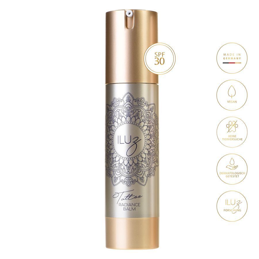 Hopeinen Radiance Balm -pullo kultaisella korkilla ja mandala-kuviolla