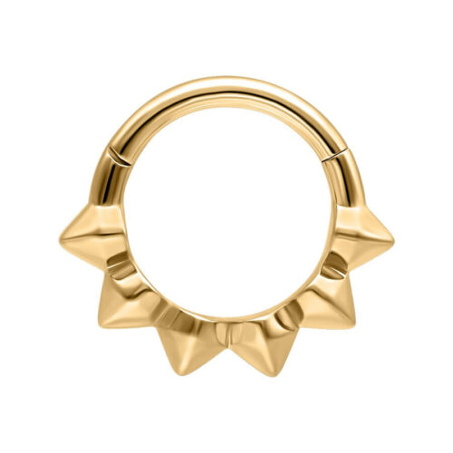 Kultainen septum-clicker terävillä piikeillä valkoisella taustalla