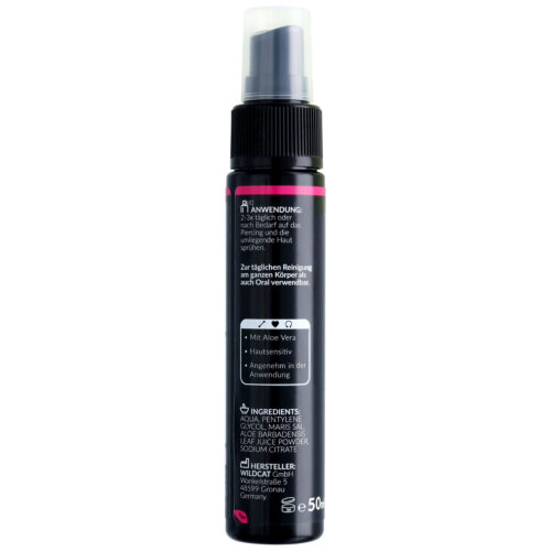 Musta lävistysuihke, jossa on valkoista ja pinkkiä tekstiä, 50 ml pullo