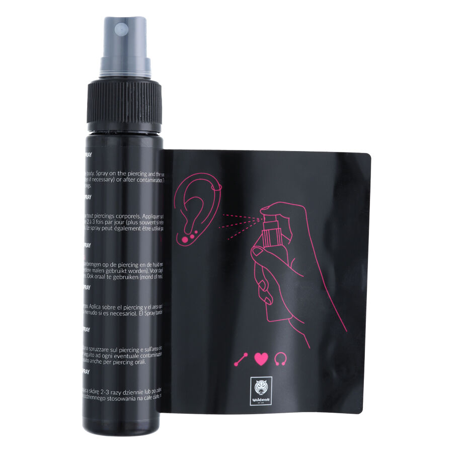 Wildcat Piercingspray-setti 60 ml ohjeineen Piercingspray-pullo ja ohje piirroksella valkoisella taustalla