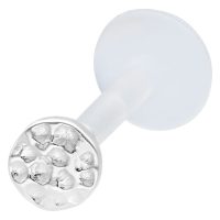 Hopeinen labret vasaroidulla päällä Hopeinen labret-lävistys vasaroidulla päällä valkoisella taustalla