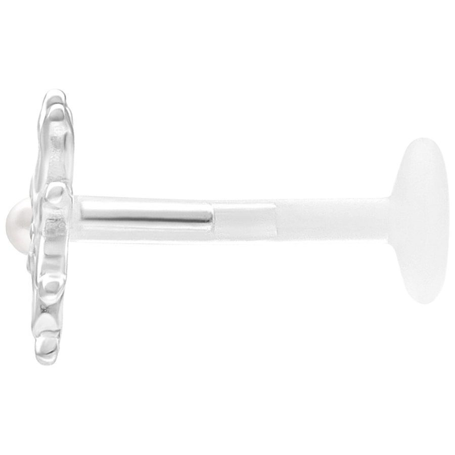 Hopeinen labret-koru kukkakoristeella valkoisella taustalla