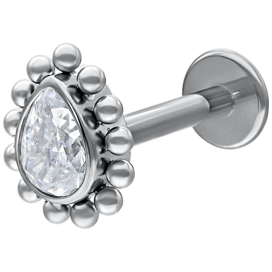 Valkokultainen labret pisaranmuotoisella kristallilla valkoisella taustalla