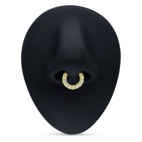 Kultainen Septum Clicker kirkkailla kristalleilla mustalla taustalla