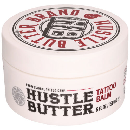 Pyöreä valkoinen purkki Hustle Butter Deluxe Tattoo Balmia punaisella ja mustalla tekstillä